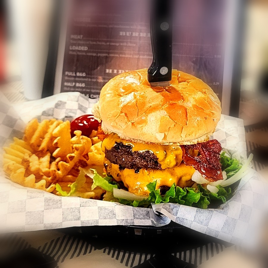 Double bacon cheeseburger with waffle fries at Combs Café